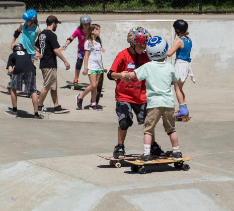 At 10 years old, Locke Pfannebecker is currently TSA's youngest coach. He learned to skate from local Williamsburg skaters, and he's seen here passing on that knowledge to Nick Atkins. (WYDaily Photo/Kellie Thomas)