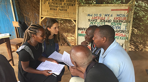 Regina Makomi of Chuka University (far left) and Darrien Spitz ’19 (second to left) interview members of a banana cooperative in Iruma, Kenya about the impact of climate change on their farming practices. (WYDaily/Courtesy of Philip Roessler)