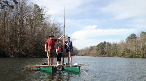Red-shirted geologist Jim Kaste works with a couple of William & Mary undergraduates from a coring platform assembled from a couple of lashed-together canoes on Lake Matoaka. (WYDaily/Courtesy of W&M Dept. of Geology)