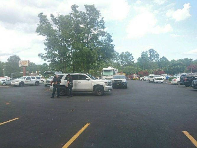 A person was apprehended by authorities Thursday afternoon at the Travelodge in Williamsburg after a three-hour-long "tactical situation." Law enforcement occupied the Cracker Barrel parking lot adjacent to the motel. (WYDaily/Julia Marsigliano)