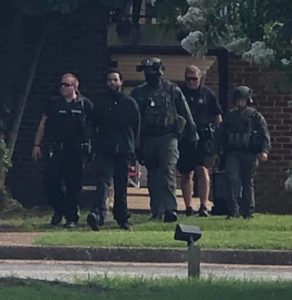 Authorities lead Evan Anthony Cole, 29, out of the Travelodge on Bypass Road in Williamsburg around 5 p.m. Thursday, July 11, 2019. (WYDaily/Courtesy of YPSO)