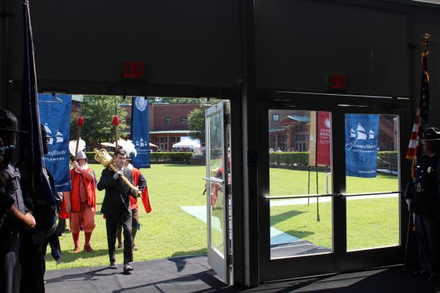 A ceremonial mace is carried into a tent where President Donald J. Trump spoke as part of commemoration events of the 400th anniversary of the beginning of democracy in the New World. (WYDaily/Alexa Doiron)