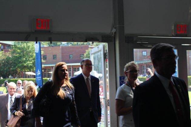 Local politicians, including Sen. Monty Mason, center, walk into a tent for programming related to the 400th anniversary commemorating the beginning of democracy in the New World. (WYDaily/Alexa Doiron)