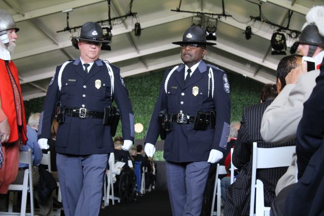 Virginia Capitol Police stand inside an event tent where President Donald Trump spoke in honor of 400 years of democracy in America Tuesday. (WYDaily/Alexa Doiron)