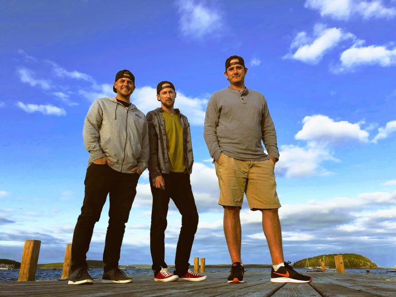 Alex Cram, Anthony Haakenson and Michael Babcock pose for a photo while on a mini golf tournament trip in Maine. (WYDaily/Courtesy of Michael Babcock)