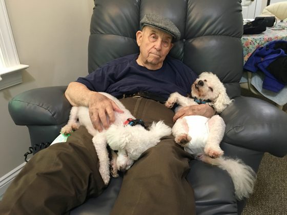 Robert Edwin Anderson, 100, sits with his two dogs Pierre and Jessica. (WYDaily/Courtesy David Greene)