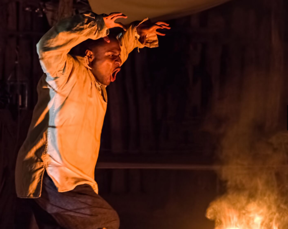 A man tells a tale at Tales of All Hallows Eve: A Haunted Evening at Historic Jamestowne. (WYDaily/Courtesy of Historic Jamestowne event listing on Virginia.org)