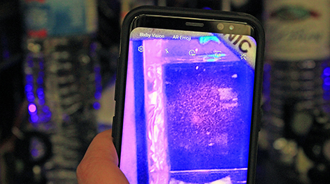 It takes a low-quality camera to view the high-tech atomic experiments going on inside William & Mary’s Ultracold Atomic, Molecular, and Optical (AMO) Physics Laboratory. This cellphone camera is able to spot a scattering of cooled atoms. (WYDaily/Courtesy of Adrienne Berard)