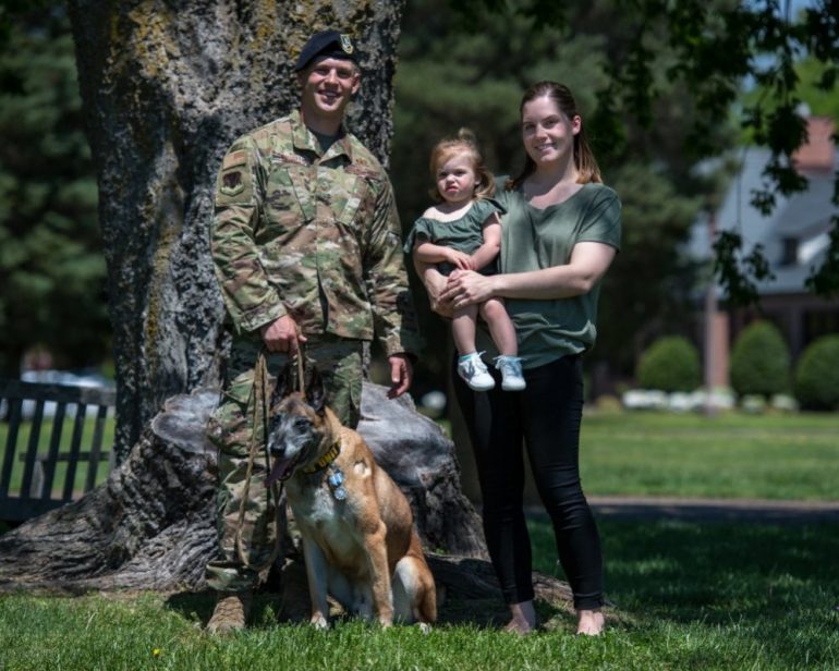 U.S. Air Force Military Working Dog Max, 633rd Security Forces Squadron explosives detector, joins the Pontello family for a family photo at Joint Base Langley-Eustis, Virginia, April 23, 2019 (WYDaily/U.S. Air Force photo by Senior Airman Anthony Nin Leclerec)
