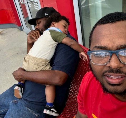 Theodoric Hunter Sr. (left) holds his grandson nearly a week before he suddenly went missing from Hampton. (WYDaily/Courtesy Theodoric Hunter Jr.)