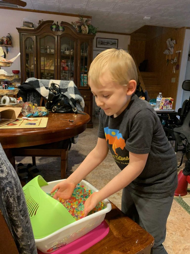Brandon Turkatte using his sensory processing toy. (WYDaily/ Courtesy of Larisa Turkatte)