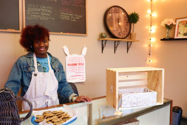 Najeonna Iman Howze stands behind the counter inside her bakery, One Girl Desserts, in Yorktown. (WYDaily/Lucretia Cunningham)
