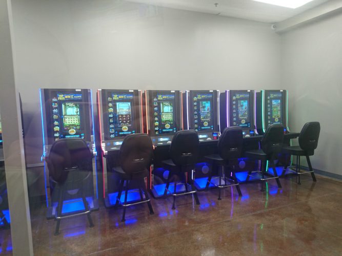 Customers entering the coffee shop can see an enclosed glass space for charitable gaming. (WYDaily/ Julia Marsigliano)