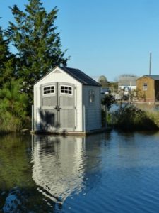 An amphibious shed rises with floodwaters in the VIMS Boat Basin. (VIMS/WYDaily)