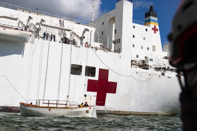 The hospital ship USNS Comfort (T-AH 20) conducts scheduled lifeboat training in accordance with U.S. Coast Guard certification and watch keeping regulations before returning to Naval Station Norfolk. The ship and its embarked medical task force remain prepared for future tasking. The Navy, along with other U.S. Northern Command dedicated forces, remains engaged throughout the nation in support of the broader COVID-19 response. (U.S. Navy photo by Mass Communication Specialist 2nd Class Sara Eshleman)