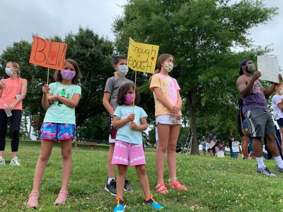 Families were encouraged to distance themselves while holdings signs and chanting. (WYDaily/Alexa Doiron)