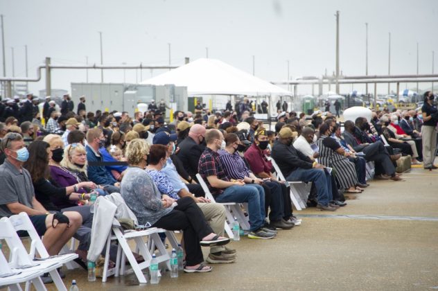 Gold Star Gamilies and guests listen to Adm. Christopher Grady, Commander, U.S. Fleet Forces Command, during the Arleigh Burke-class guided missile destroyer USS Cole (DDG 67) 20th Anniversary memorial ceremony at Naval Station Norfolk. (U.S. Navy photo by Senior Chief Mass Communication Specialist Narina Gray)