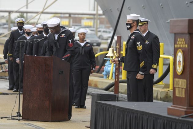 Gas Turbine Systems Technician (Mechanical) 1st Class Quazavier Henderson honors Engineman 2nd Class Marc Nieto during roll call at the Arleigh Burke-class guided missile destroyer USS Cole (DDG 67) 20th Anniversary memorial ceremony at Naval Station Norfolk. (U.S. Navy photo by Mass Communication Specialist 2nd Class Darien G. Kenney)