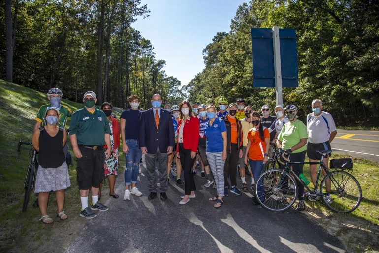 W&M President Katherine Rowe and Mayor Doug Pons are joined by Williamsburg Area Bicyclists and Colonial Road Runners at the new bike path dedication along Monticello Ave. at the corner of Compton Drive, on the campus of W&M Oct. 1, 2020.