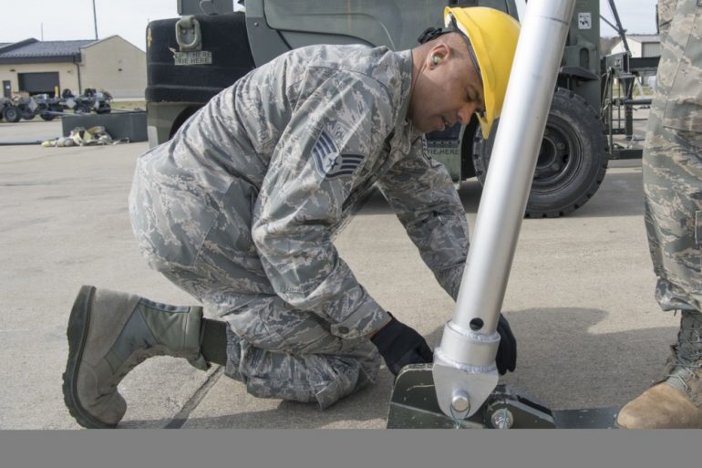 Staff Sgt. Edward Porter III, 192nd Maintenance Squadron munitions systems technician, builds a munitions assembly conveyer as part of annual training on March 11, 2020, at Joint Base Langley-Eustis. (U.S. Air National Guard photo by Tech. Sgt. Lucretia Cunningham)