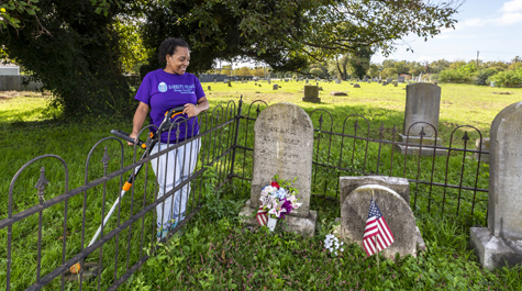 Ghana Smith, a financial system specialist at William & Mary, has been coordinating the Barrett-Peake Heritage Foundation’s restoration project of two Hampton cemeteries for nearly 18 months. (WYDaily/Courtesy of Jim Agnew, W&M News)