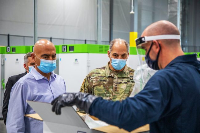 Dr. Moncef Slaoui, left, chief advisor to Operation Warp Speed, and Army Gen. Gustave F. Perna, chief operating officer of OWS, visit a UPS freezer farm in Louisville, Kentucky, on Dec. 3. (Photo by Ryan Davis, UPS/ Courtesy of William & Mary News)