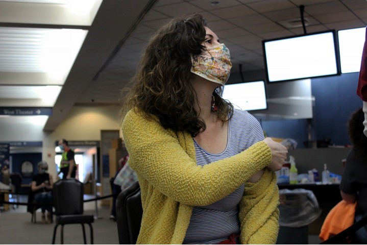 Sarah Bottiglieri, pre-school teacher at Laurel Lane Elementary School receives a dose of the Moderna vaccine at the Colonial Williamsburg Visitors Center. (WYDaily/Courtesy of the City of Williamsburg)
