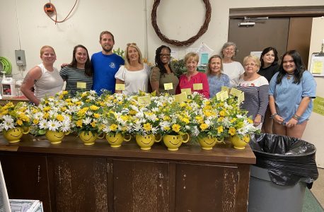 Volunteers pose with their floral bouquets that were delivered during Make Someone Smile Week. (Courtesy Morrison's Flowers and Gifts)